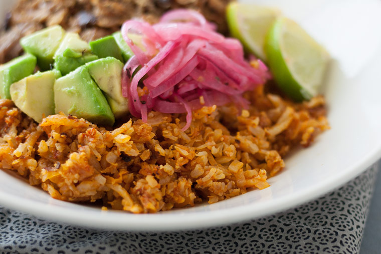 plate of Mexican Cauliflower Rice with Pressure Cooker Pork Carnitas